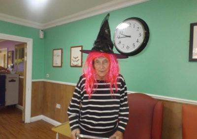 Princess Christian Care Home resident in witches hat and bright wig