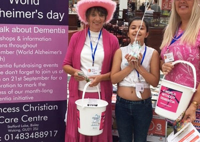 Staff with fundraising buckets in Camberley town centre