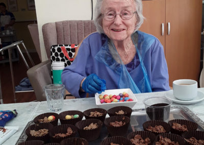Princess Christian resident decorating cakes for Easter 2020