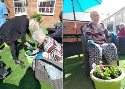 Residents and staff potting plants in the Bisley Unit courtyard garden at Princess Christian Care Home