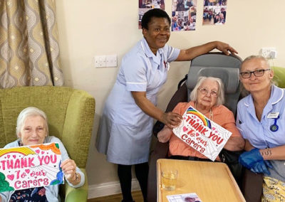 Residents showing off their staff 'thankyou' posters