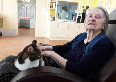 Resident cuddling the Home's cat at Princess Christian