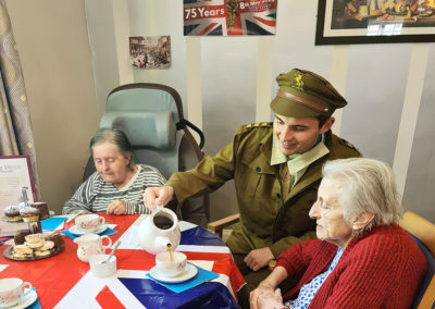 Princess Christian Care Home residents enjoying tea and cake in VE Day 2020