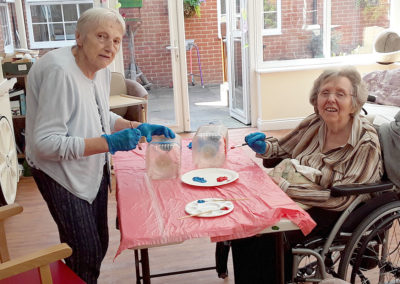 Princess Christian residents painting plant holders for the garden