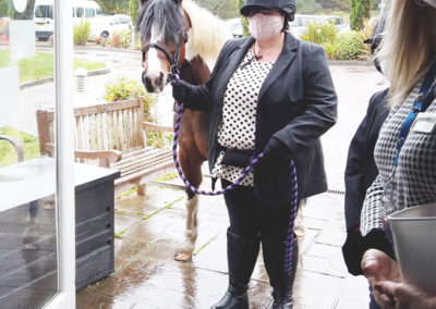Princess Christian Care Home resident on her 100 birthday having a visit from a local pony and owner