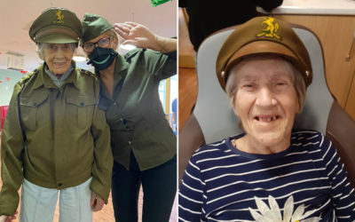 Residents trying on army uniforms at Princess Christian Care Home