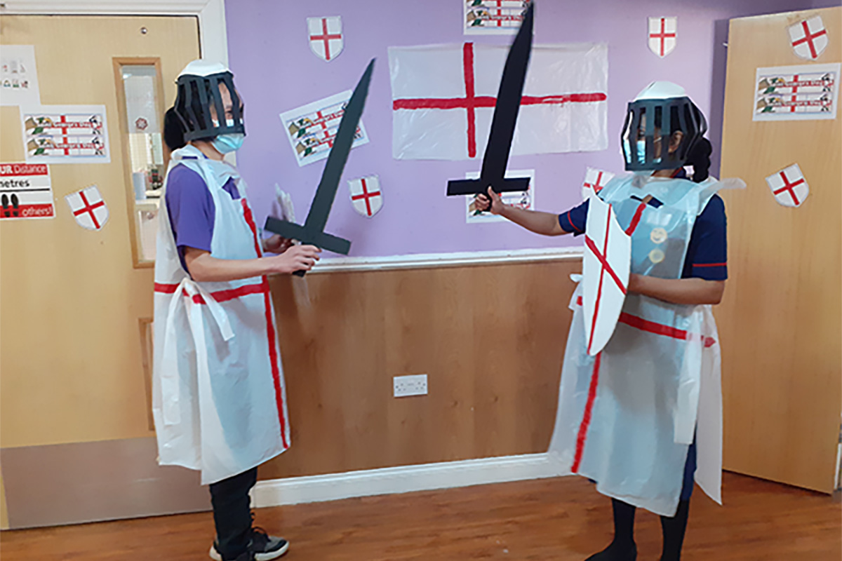 Princess Christian Care Home staff dress as St George, play fighting with swords
