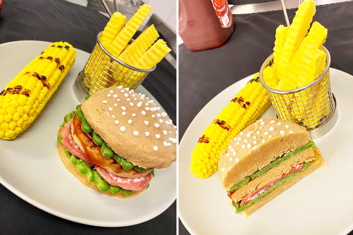 Moulded burger, chips and corn on the cob