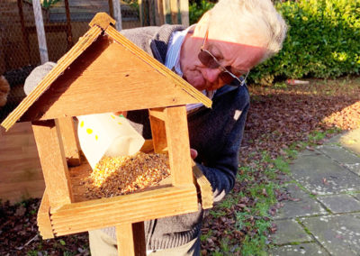 Filling bird feeders at Princess Christian Care Home 8