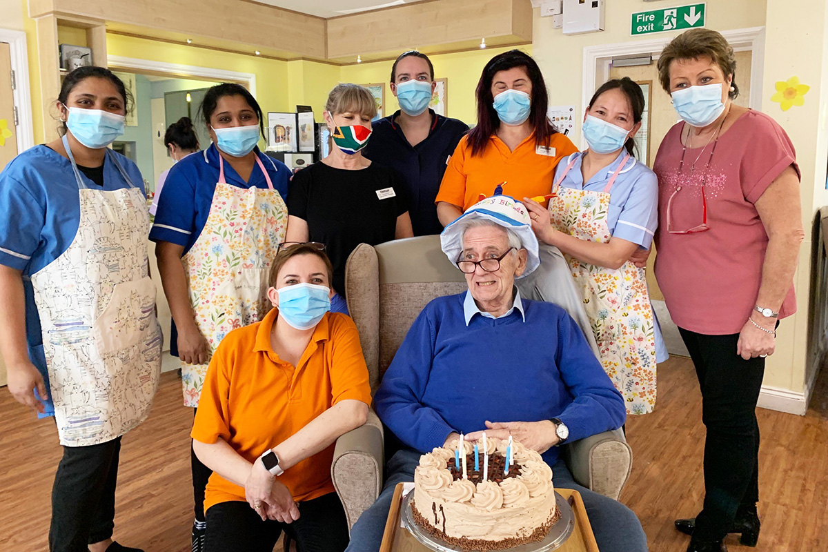 Princess Christian Care Home staff with a male resident on his birthday