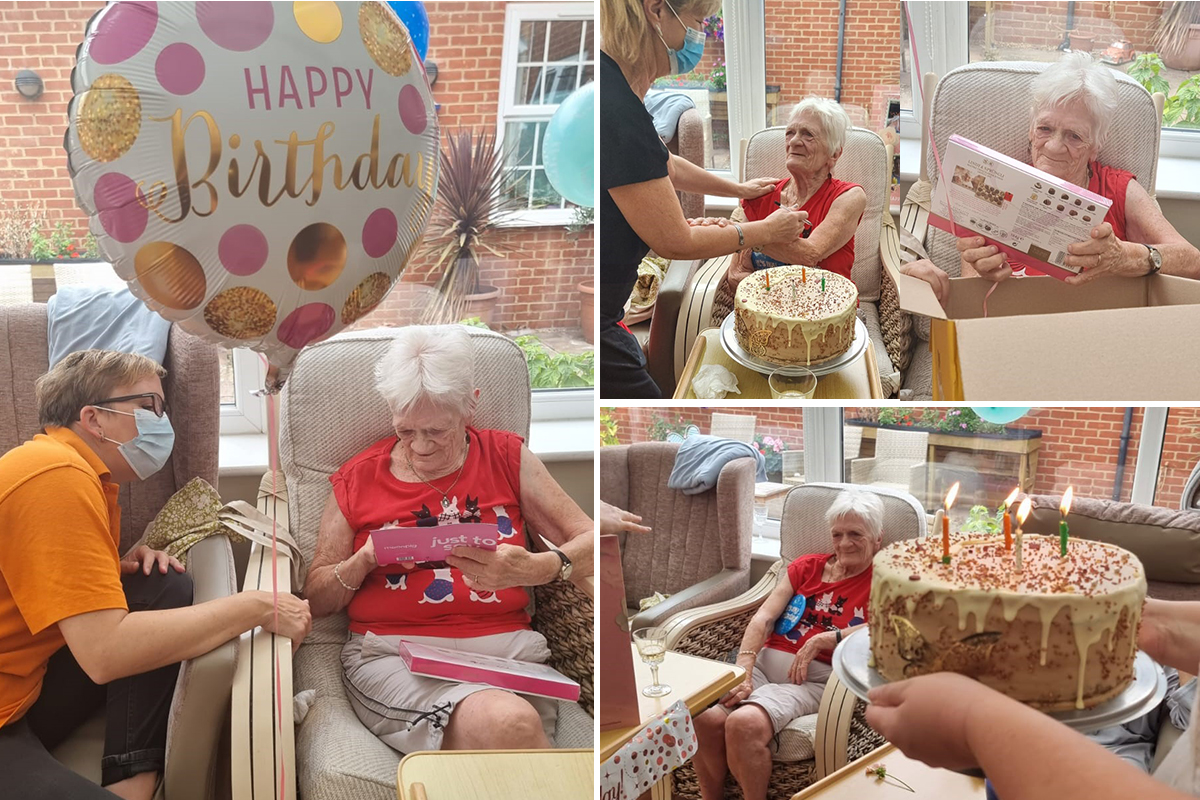 Doreen with her birthday cake and goodies at Princess Christian Care Home