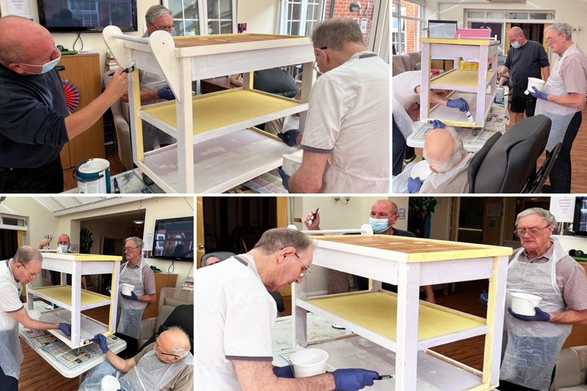 Princess Christian Care Home residents enjoying painting a trolley together 