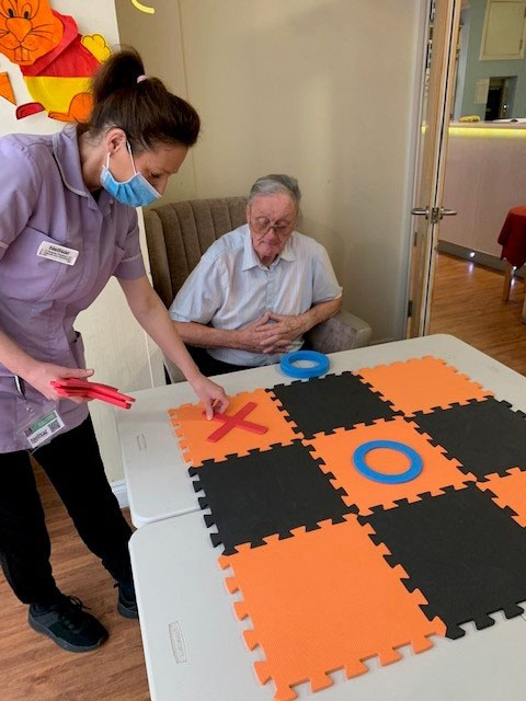 Playing noughts and crosses at Princess Christian Care Home